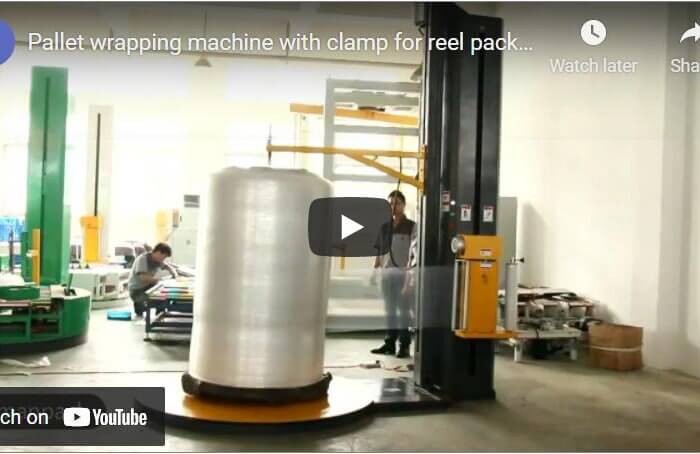 Pallet wrapping machine with clamp for reel packaging