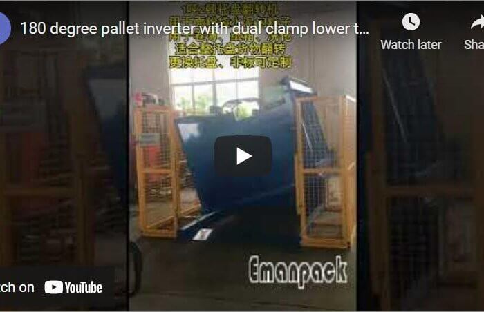 Pallet inverter with floor level clamps loading via hand pallet truck